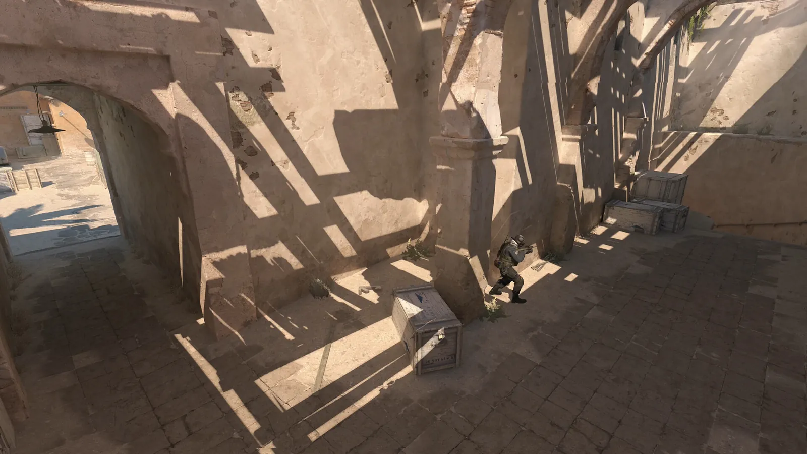Counter-Strike 2 gameplay showing a player holding a tactical angle.